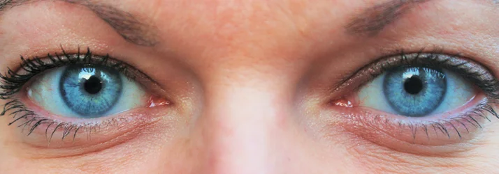 A close up of a persons blue eyes.