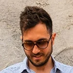 A man wearing tortoiseshell sunglasses.